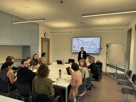 A group of people sitting around a table

AI-generated content may be incorrect.